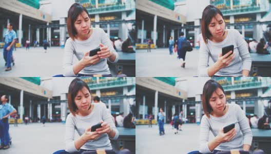 一名女子在香港街头使用智能手机高清在线视频素材下载