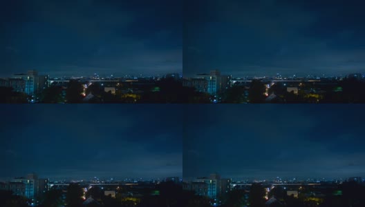 夜间，暴风雨的云层伴随着闪电掠过曼谷的城市景观。1080年FHD间隔拍摄高清在线视频素材下载