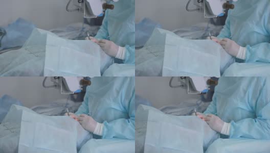 使用消毒设备进行手术时，双手戴上手术手套高清在线视频素材下载