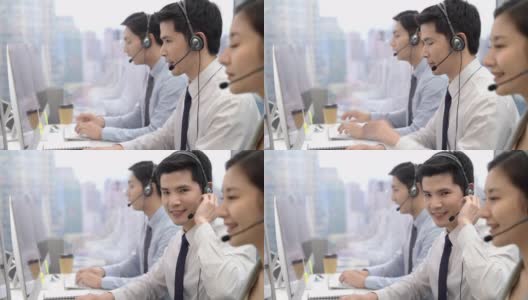 对着镜头微笑的男性电话营销接线员高清在线视频素材下载