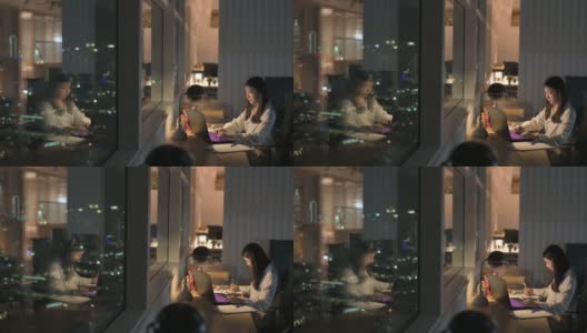 亚洲华裔女白领在办公室工作到深夜独自赶财务报告高清在线视频素材下载