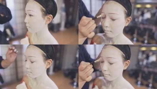 舞妓(训练中的艺妓)得到特殊的白色化妆高清在线视频素材下载