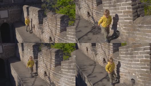 斯坦尼康镜头拍摄了一个小男孩走上中国长城的楼梯高清在线视频素材下载