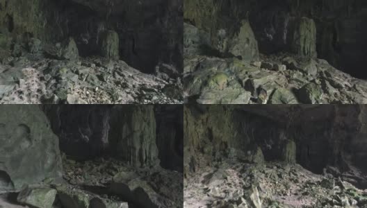 山洞里黑洞洞的，隐约可以看见一些钟乳石的轮廓高清在线视频素材下载