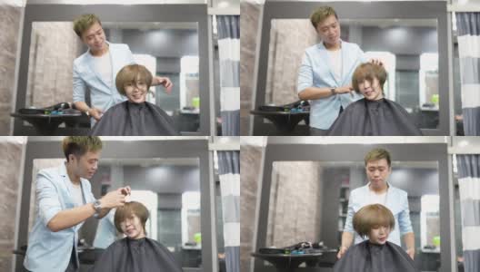 亚洲华人女顾客摇着她的头发，美发师为她做最后的造型。高清在线视频素材下载