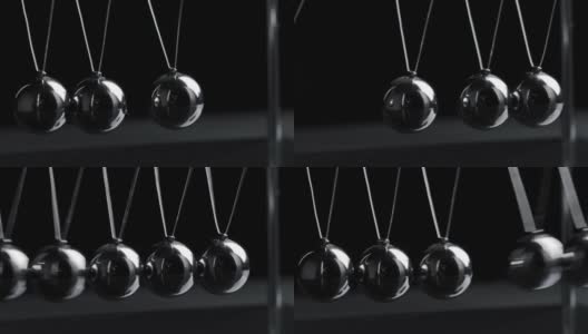 视频悬挂钢牛顿球运动在黑色背景高清在线视频素材下载