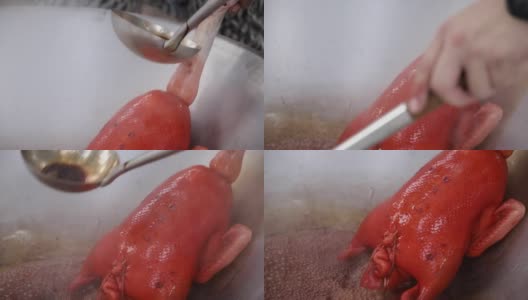 厨师用沸水和食用色素焯整只鸭子，厨师用勺子将沸水和食用色素倒在整只鸭子上高清在线视频素材下载