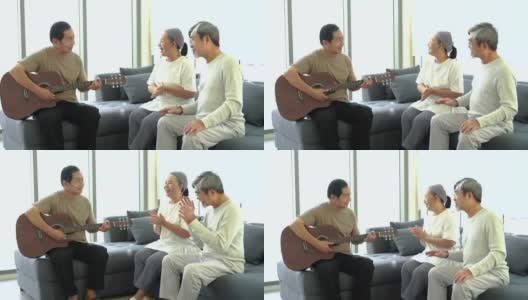 一群老人在客厅里唱歌、弹吉他。高清在线视频素材下载