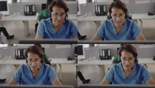 亚洲医生在呼叫中心办公室的电脑上对病人进行远程健康咨询。高清在线视频素材下载