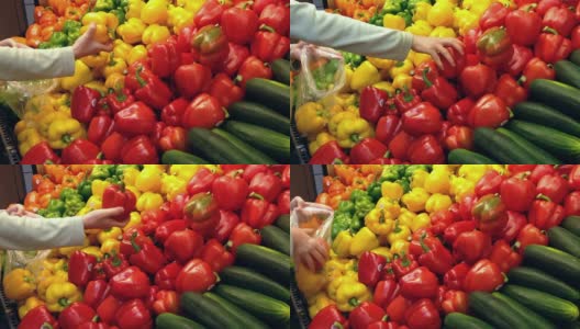 在杂货店挑选红黄辣椒的女人高清在线视频素材下载