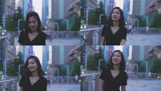 年轻漂亮的女孩走在城市里，慢镜头高清在线视频素材下载