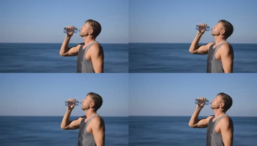 一名男子一边喝水，一边把塑料瓶里的水倒在海里，让自己在锻炼后神清气爽高清在线视频素材下载