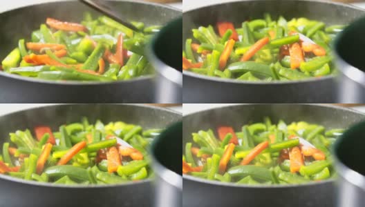 用平底锅搅拌新鲜蔬菜高清在线视频素材下载