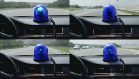 在高速公路上驾驶带蓝色闪光灯的汽车高清在线视频素材下载