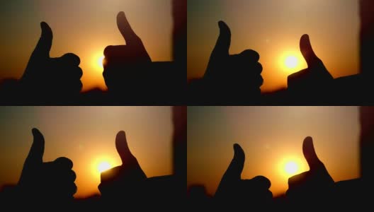 在城市日落时，女性和男性伸出大拇指的慢动作高清在线视频素材下载