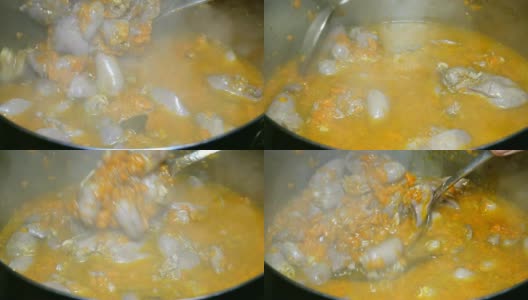 烹饪自制的食物。炖牛肉或用胡萝卜煮的鸡内脏浓汤。高清在线视频素材下载