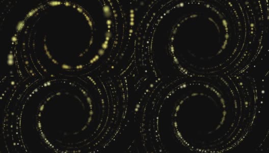 黄色圆形粒子在黑色背景的空间中缓慢的圆周运动高清在线视频素材下载