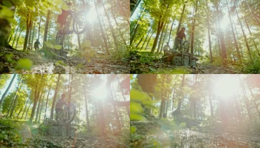 超级SLO MO MTB摩托车手跳过一个木斜坡在阳光明媚的森林高清在线视频素材下载