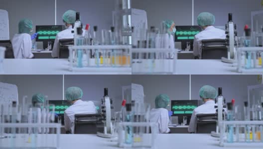 新冠病毒疫苗由制药生物研发科学家团队研发。专业研究人员在covid-19疫苗和药品生产公司实验室工作高清在线视频素材下载