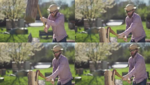 阳光明媚的春日里，一个戴着草帽穿着格子衬衫的男人正在花园里劈柴高清在线视频素材下载