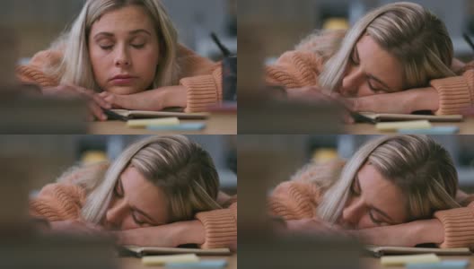 一段4k视频显示一名女子在学习间隙小睡高清在线视频素材下载