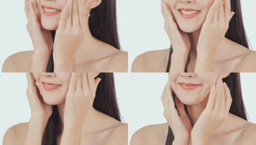 美丽的年轻亚洲女人的肖像触摸脸和健康的皮肤。高清在线视频素材下载