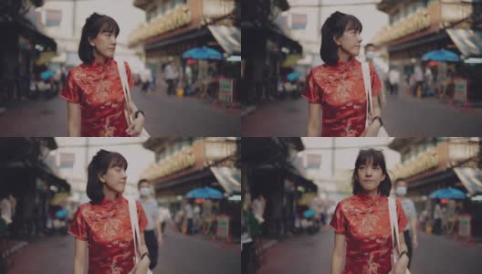 亚洲女性穿旗袍购物。高清在线视频素材下载