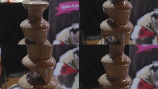 一段巧克力喷泉的镜头，画面从上往下移动高清在线视频素材下载