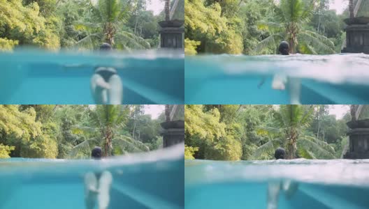 一个女人在水下游泳的半镜头高清在线视频素材下载
