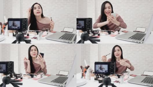 年轻的亚洲女性美容视频博主录制化妆教程高清在线视频素材下载
