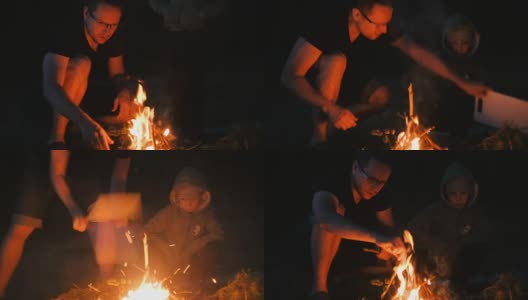 儿子和爸爸在森林里生火。家庭露营。高清在线视频素材下载