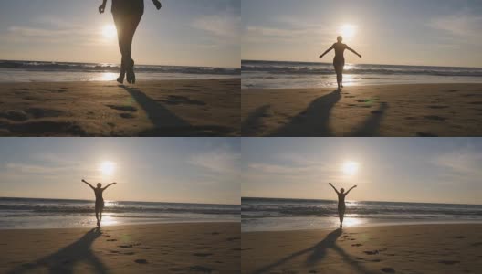 一位年轻女子在日落时分跑到海边，举起手。美丽的年轻女孩在沙滩上去海边享受假期的自由。暑假放松一下。后方后视图高清在线视频素材下载