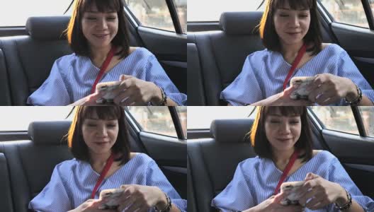一个在车里打电话的亚洲女人高清在线视频素材下载