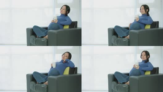 坐在沙发上的亚洲孕妇高清在线视频素材下载