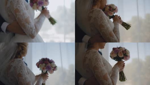 幸福的新娘和新郎站在窗边高清在线视频素材下载