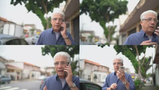 一位老人一边在城市里行走一边用手机打电话高清在线视频素材下载