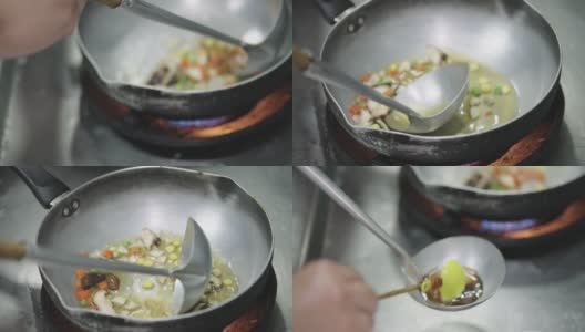 厨师用浓汁炒拌蔬菜调味。高清在线视频素材下载