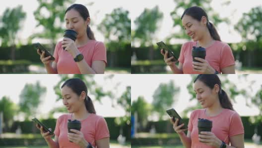 亚洲年轻美女的肖像站着看智能手机高清在线视频素材下载