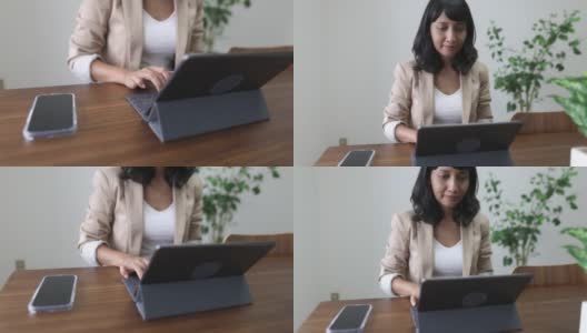 一个亚洲女人在会议室工作高清在线视频素材下载