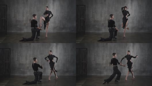 年轻优雅的千禧一代舞蹈舞厅夫妇在黑色礼服在垃圾摇滚的背景下跳舞的性感姿势。高清在线视频素材下载