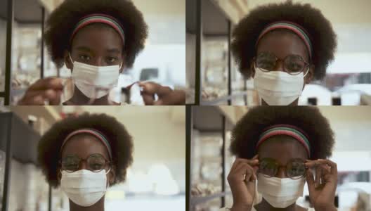 非洲少女在商店挑选新眼镜高清在线视频素材下载