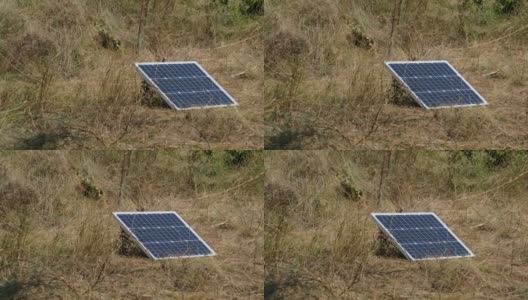 便携式太阳能电池板安装在地面上，可在户外发电高清在线视频素材下载