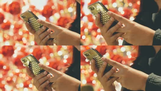 中国新年:亚洲女性使用智能手机高清在线视频素材下载