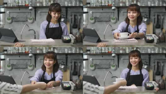 在一家当地的咖啡店里，一位漂亮的女咖啡师正在为一位女顾客点单高清在线视频素材下载