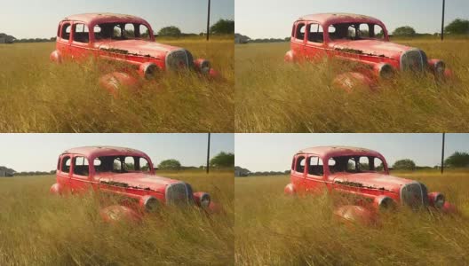 橙色面板货车被遗弃的汽车草在风中吹动高清在线视频素材下载