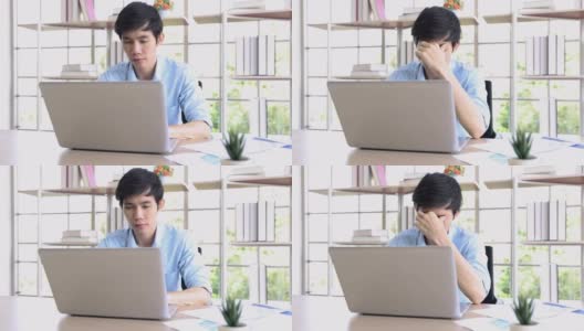 亚洲男人因为长时间的工作而感到压力和疲惫，在家工作。高清在线视频素材下载