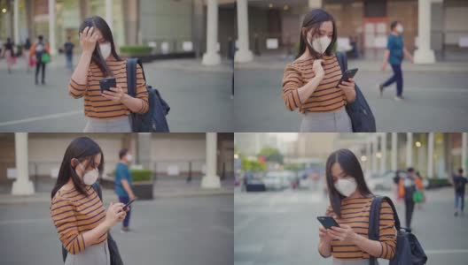亚洲女人用智能手机走路高清在线视频素材下载