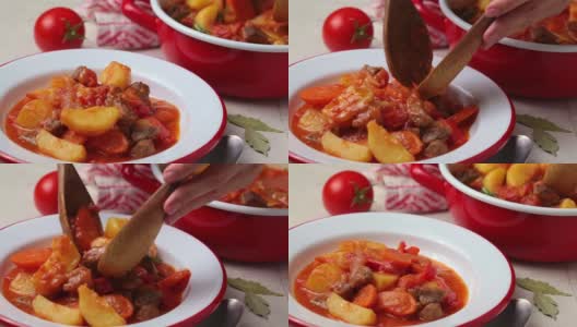 土豆和胡萝卜炖牛肉，加番茄酱，放在白色盘子里。高清在线视频素材下载