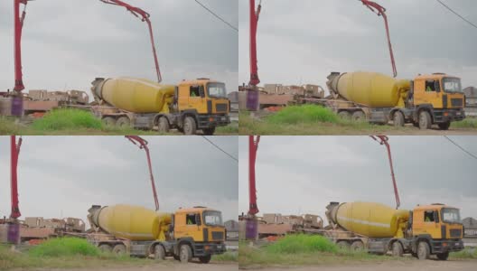 混凝土卡车在建筑工地卸下混凝土高清在线视频素材下载