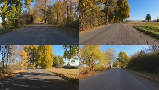 从汽车上看秋天的风景，秋天的乡村风景中的彩色树木和晴天的蓝天。高清在线视频素材下载